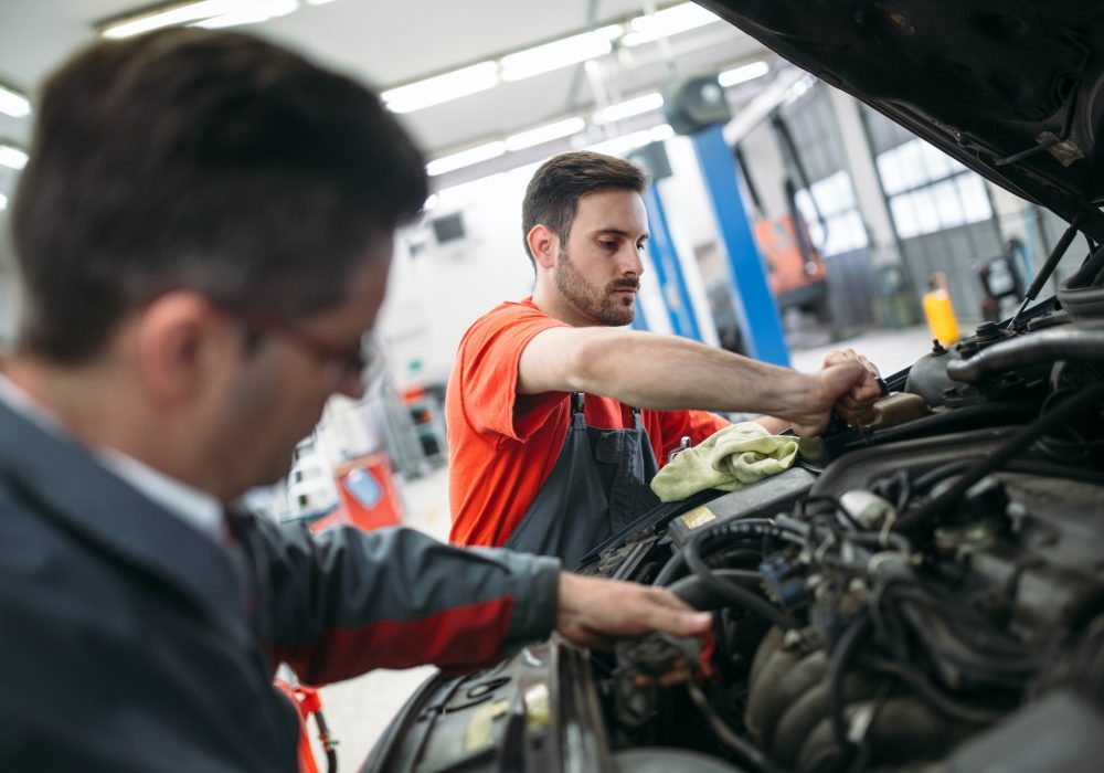 profecional-car-mechanic-changing-motor-oil-at-maintenance-repair-service-station.jpg